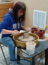 Picture of Sylvie at the pottery wheel